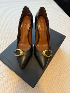 Coach Black Leather Pointed Toe Pumps with Gold Accent